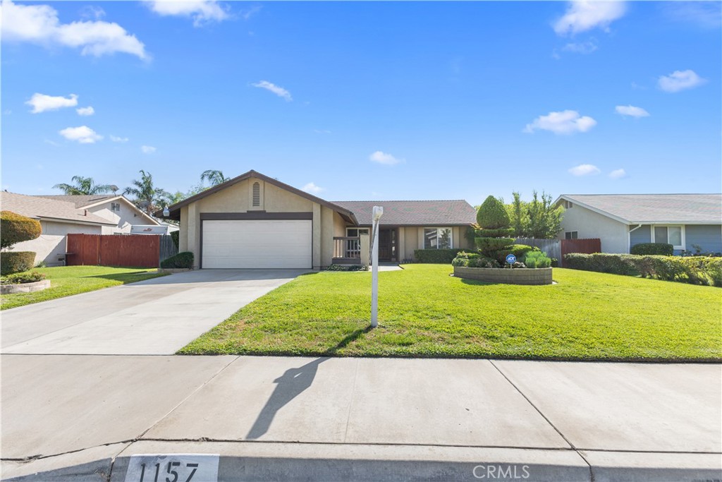 1157 West Orchard Street Rialto, CA 92376 - Photo 3 of 38 a view of front a house with a yard