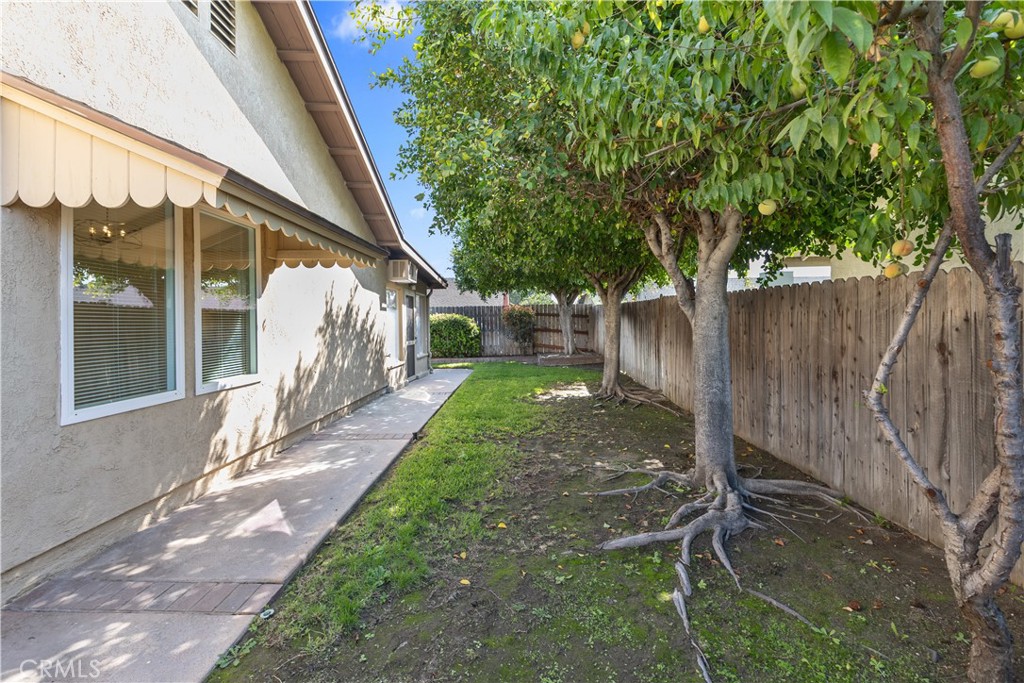 1157 West Orchard Street Rialto, CA 92376 - Photo 35 of 38 a view of a backyard with a tree