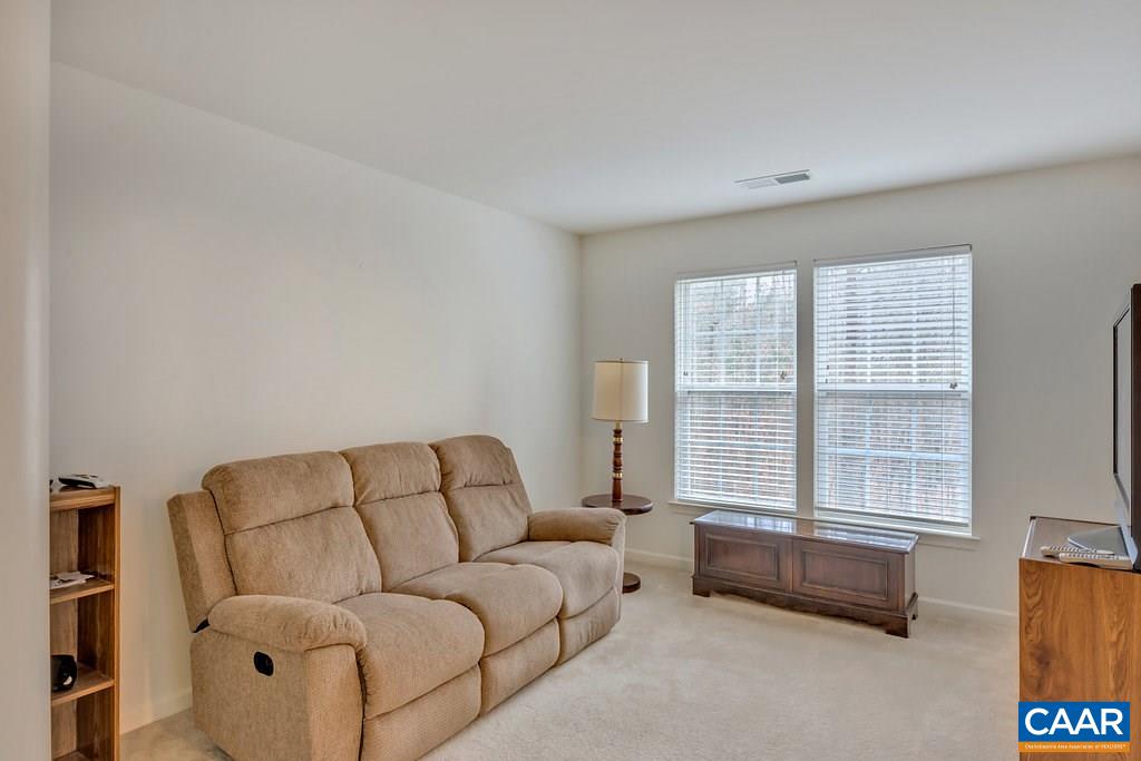 437 Willow Ridge Road Troy, VA 22974 - Photo 25 of 45 a living room with furniture and a window