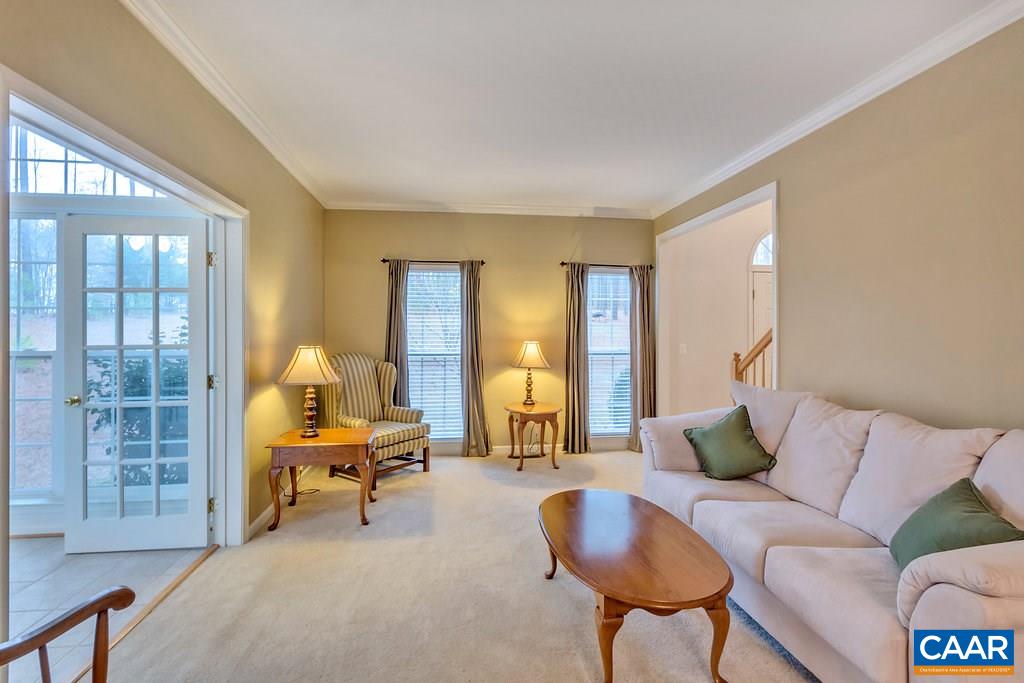 437 Willow Ridge Road Troy, VA 22974 - Photo 6 of 45 a living room with furniture and a lamp