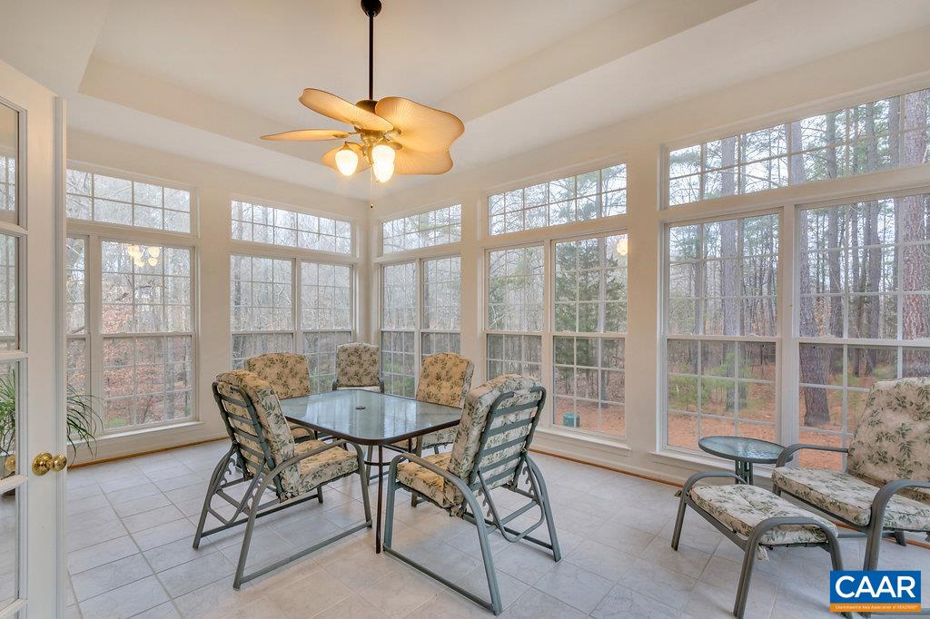 437 Willow Ridge Road Troy, VA 22974 - Photo 7 of 45 a dining room with furniture a chandelier and wooden floor