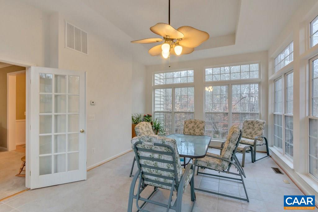 437 Willow Ridge Road Troy, VA 22974 - Photo 8 of 45 a dining room with furniture a chandelier and wooden floor