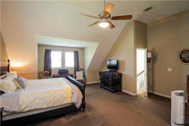 3612 Mahlon Moore Road Spring Hill, TN 37174 - Photo 11 of 20 a bedroom with a bed and window