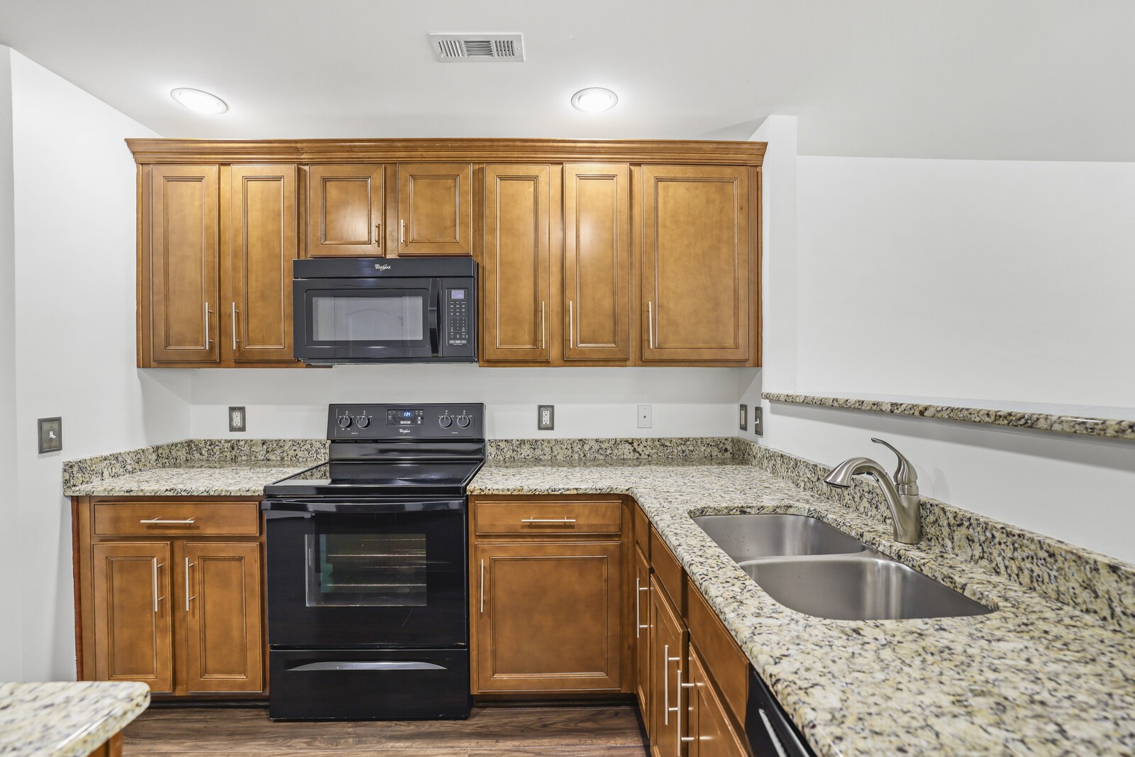 3946 Hoggett Ford Road Hermitage, TN 37076 - Photo 11 of 28 a kitchen with granite countertop a sink stove and cabinets