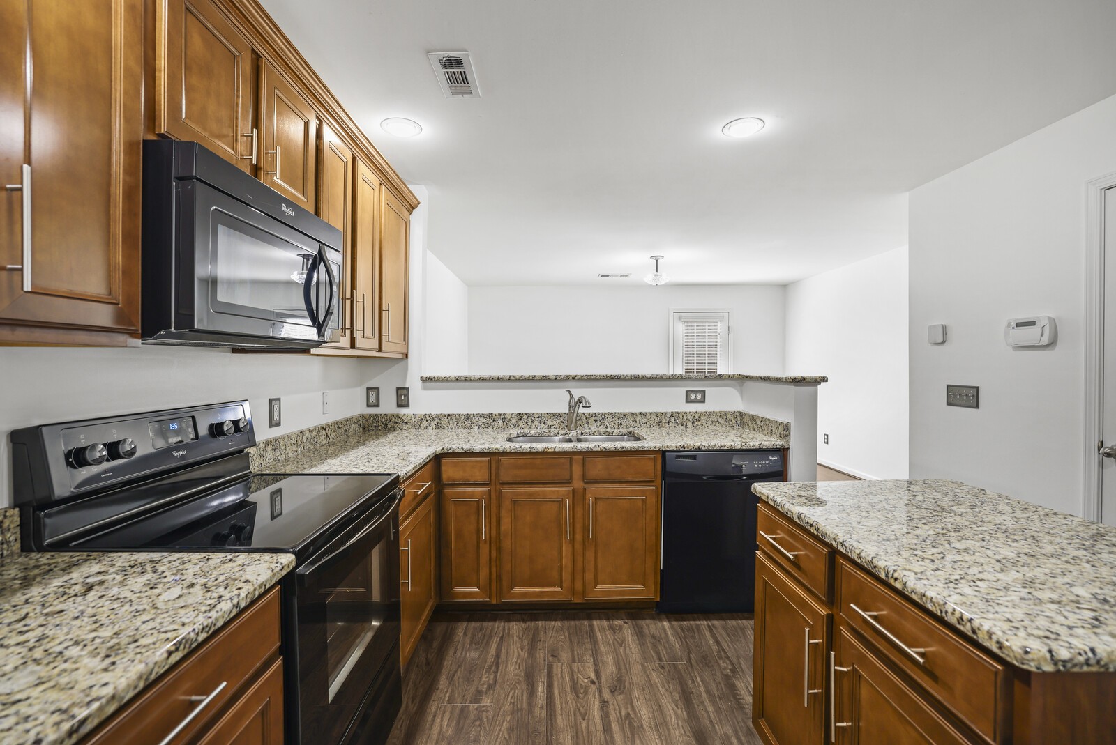 3946 Hoggett Ford Road Hermitage, TN 37076 - Photo 13 of 28 a kitchen with stainless steel appliances granite countertop a sink stove and refrigerator