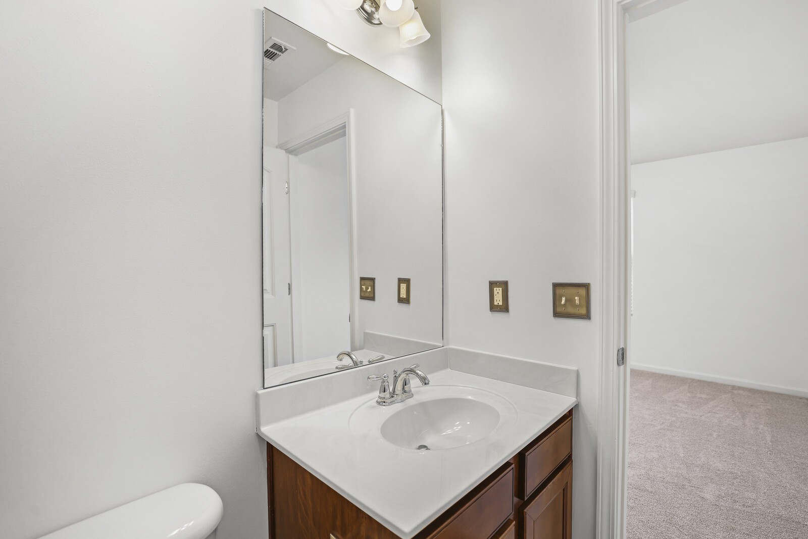 3946 Hoggett Ford Road Hermitage, TN 37076 - Photo 19 of 28 a bathroom with a sink toilet and mirror