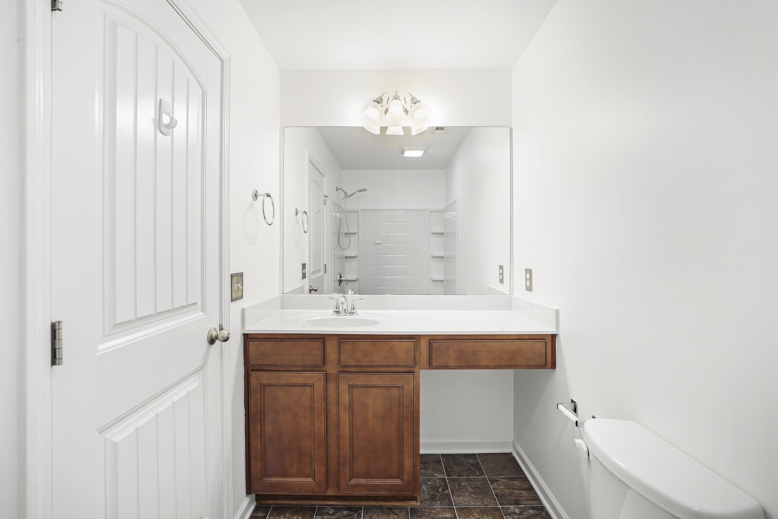 3946 Hoggett Ford Road Hermitage, TN 37076 - Photo 23 of 28 a bathroom with a sink mirror and a bathtub