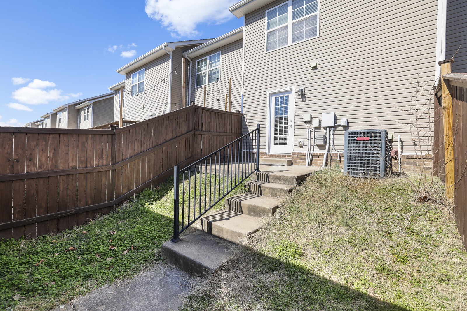 3946 Hoggett Ford Road Hermitage, TN 37076 - Photo 25 of 28 a view of a house with a small yard and wooden fence