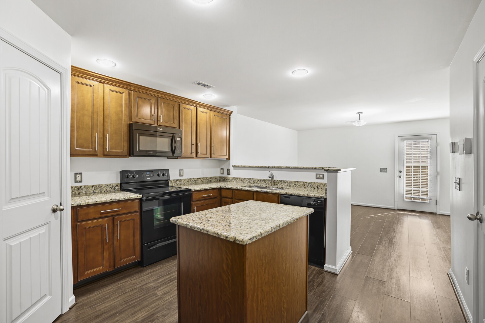 3946 Hoggett Ford Road Hermitage, TN 37076 - Photo 9 of 28 a kitchen with a stove a sink and a microwave
