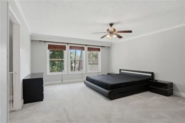 a room with a bed and a chandelier