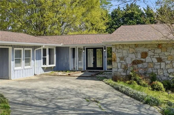 a house with trees in the background