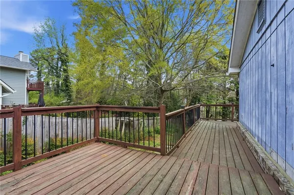 a view of balcony with wooden floor