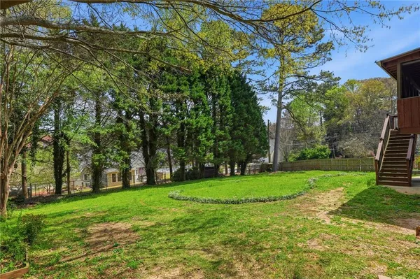 a view of a park with large trees
