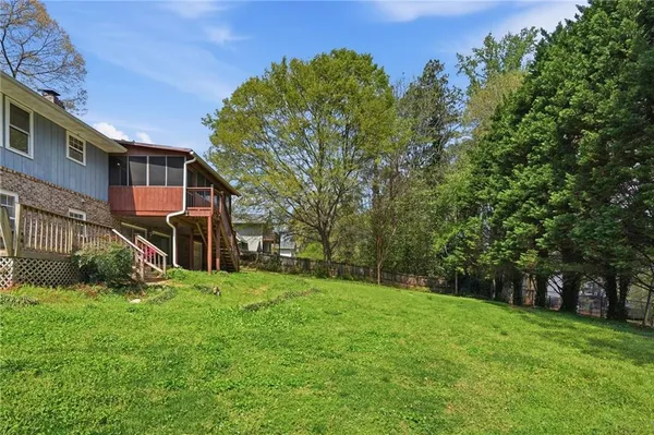 a backyard of a house with lots of green space