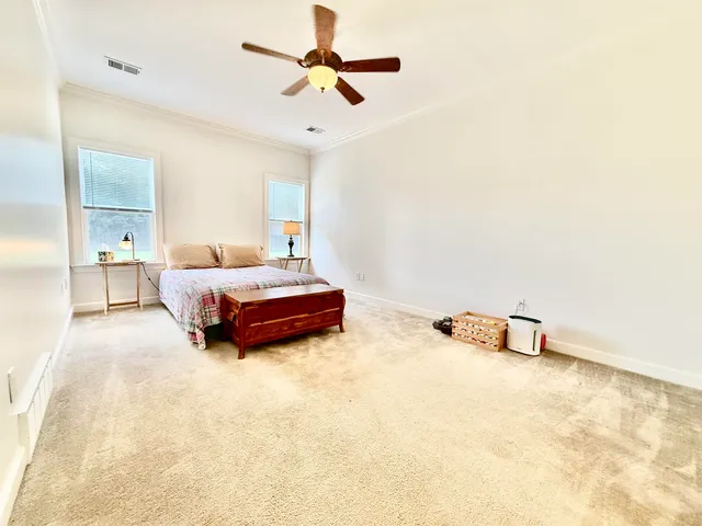 a view of kitchen with furniture and a wooden floor