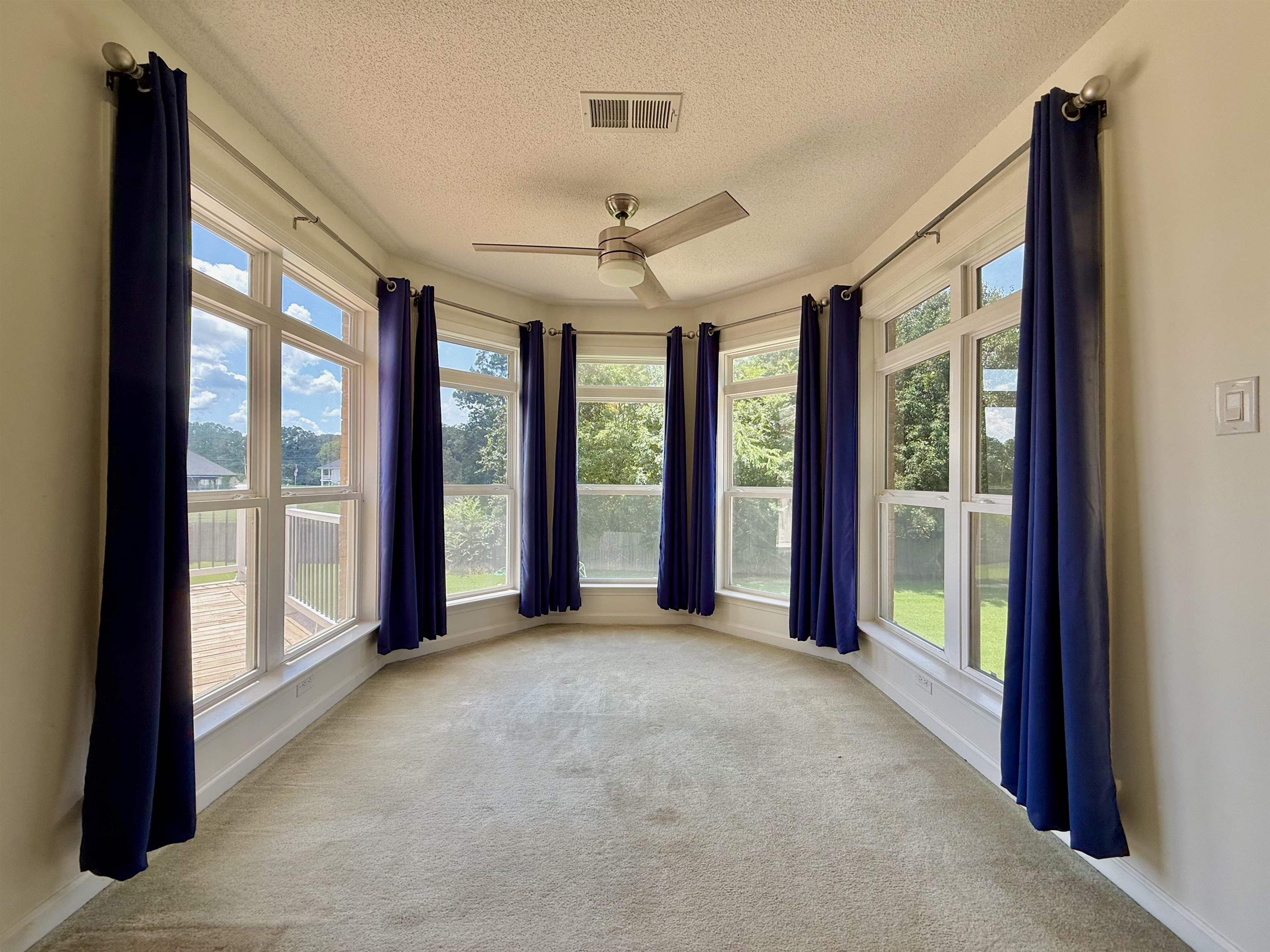 2620 Tomlin Road Somerville, TN 38068 - Photo 29 of 40 a view of a room with large windows and chandelier