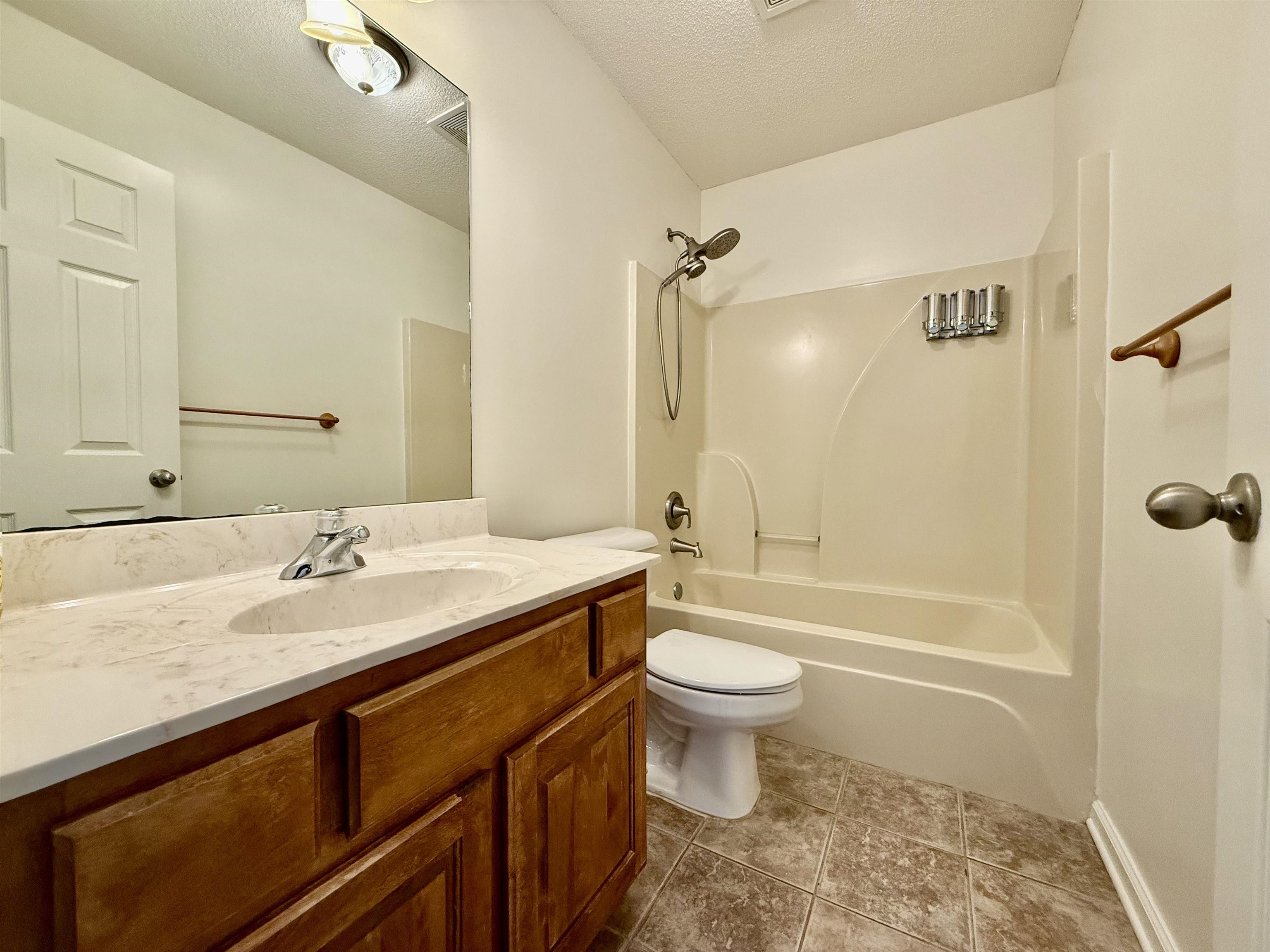 2620 Tomlin Road Somerville, TN 38068 - Photo 31 of 40 a bathroom with a sink a toilet and shower