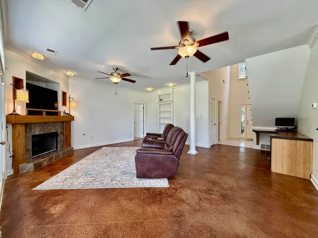 a living room with furniture and a fireplace