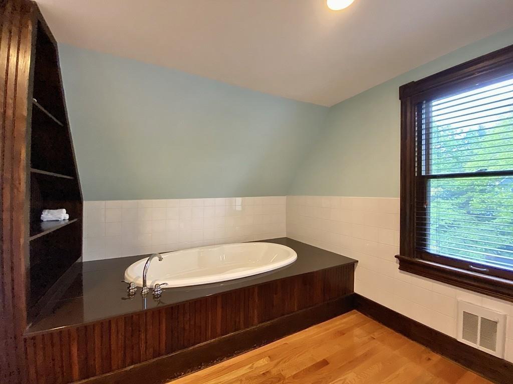 35 Washington Road Springfield, MA 01108 - Photo 35 of 42 a bathroom with a bathtub and window