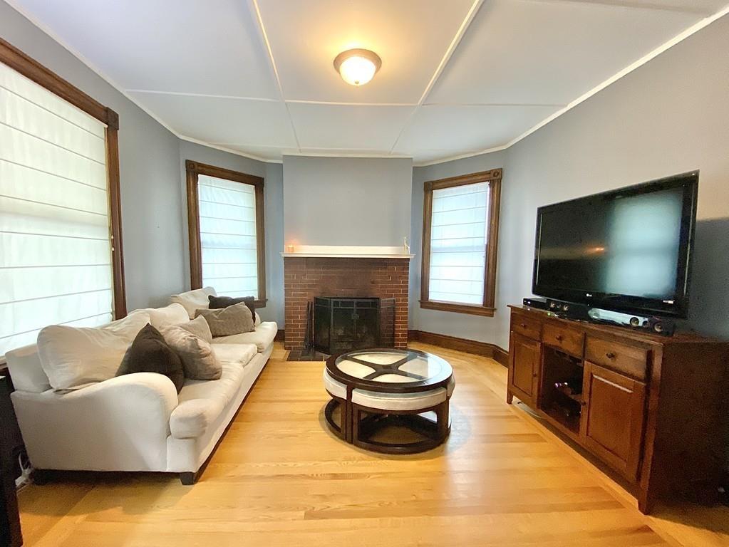 35 Washington Road Springfield, MA 01108 - Photo 8 of 42 a living room with furniture and a flat screen tv