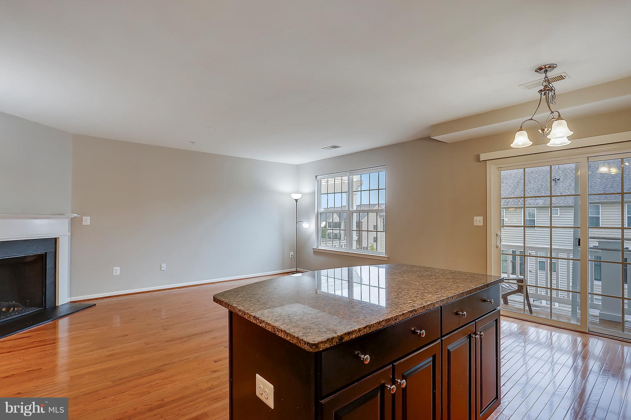 22932 Newcut Road, Unit 2272 Clarksburg, MD 20871 - Photo 6 of 30 Kitchen has center island