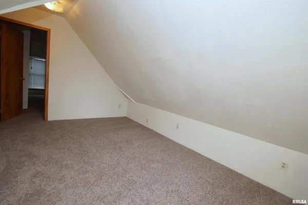 a view of an empty room with a hallway
