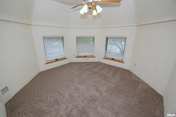 a kitchen with sink cabinets and wooden floor