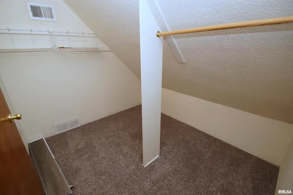a room with gym equipment and a table