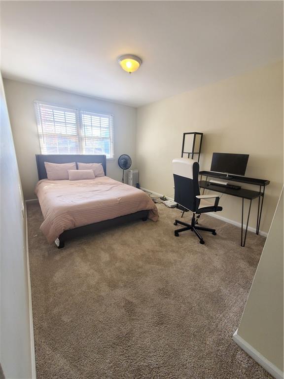 6520 Roswell Road, Unit 59 Atlanta, GA 30328 - Photo 11 of 19 a bed room with a bed and a desk