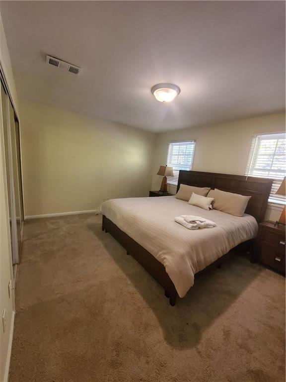 6520 Roswell Road, Unit 59 Atlanta, GA 30328 - Photo 13 of 19 a bedroom with a bed and window