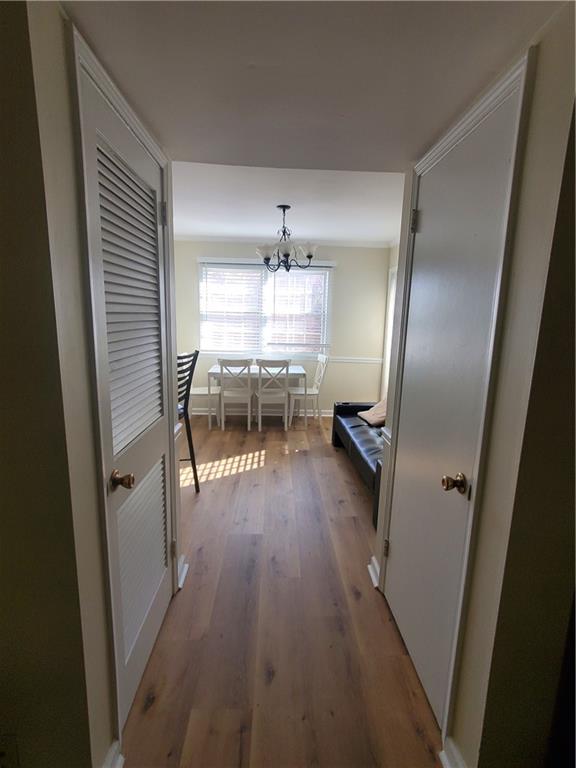 6520 Roswell Road, Unit 59 Atlanta, GA 30328 - Photo 16 of 19 a kitchen with a sink and wooden floor