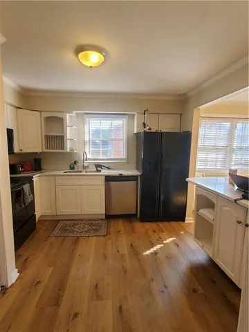 a kitchen with a cabinets and appliances