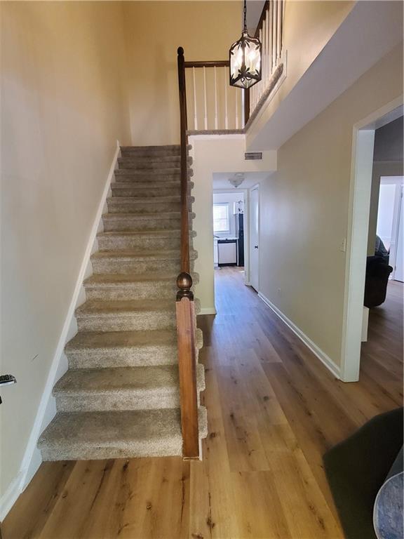 6520 Roswell Road, Unit 59 Atlanta, GA 30328 - Photo 7 of 19 a view of entryway and hall with wooden floor
