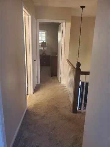 a view of hallway with a mirror