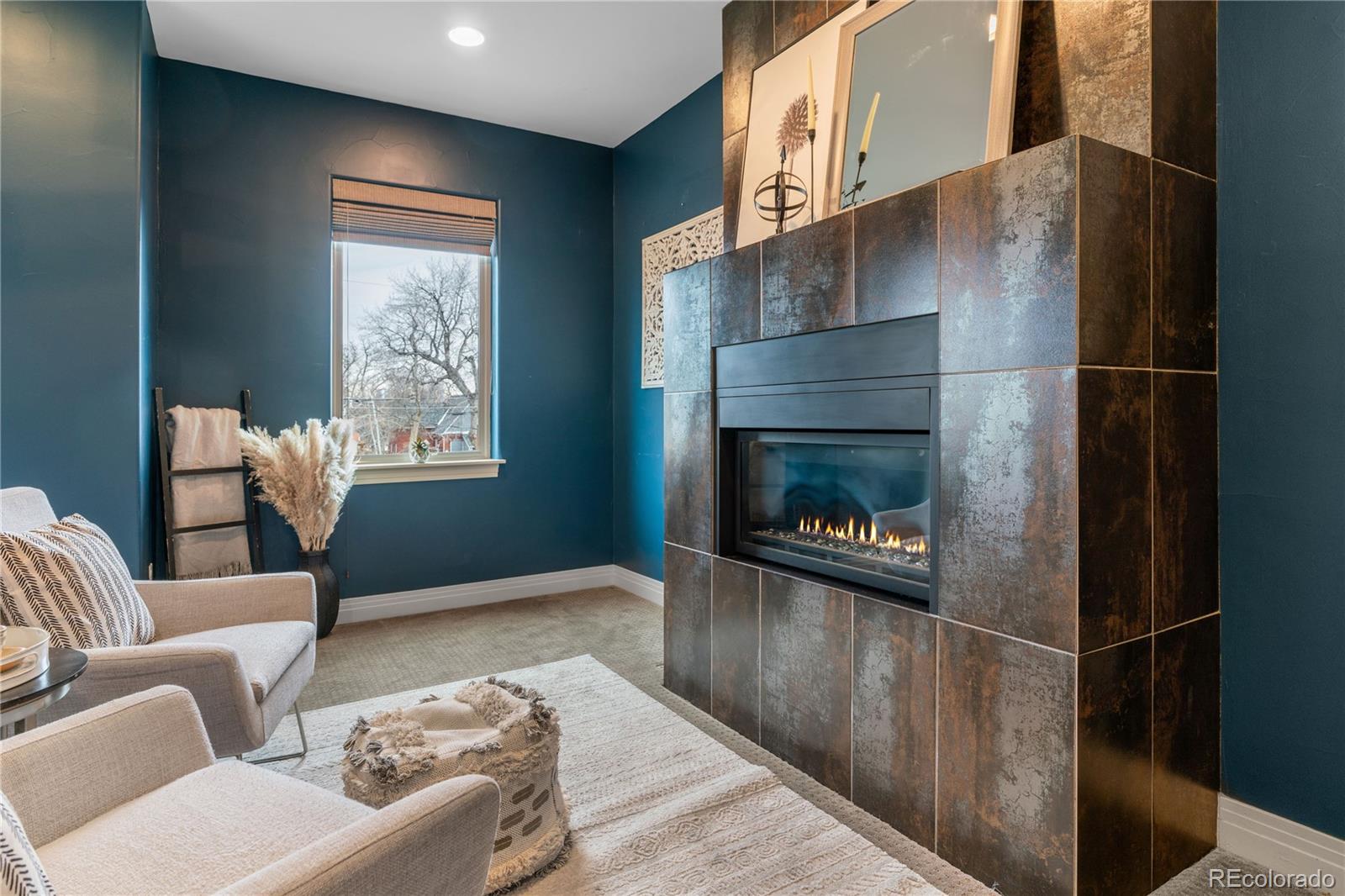 2334 Lowell Boulevard Denver, CO 80211 - Photo 17 of 42 a living room with furniture and a fireplace