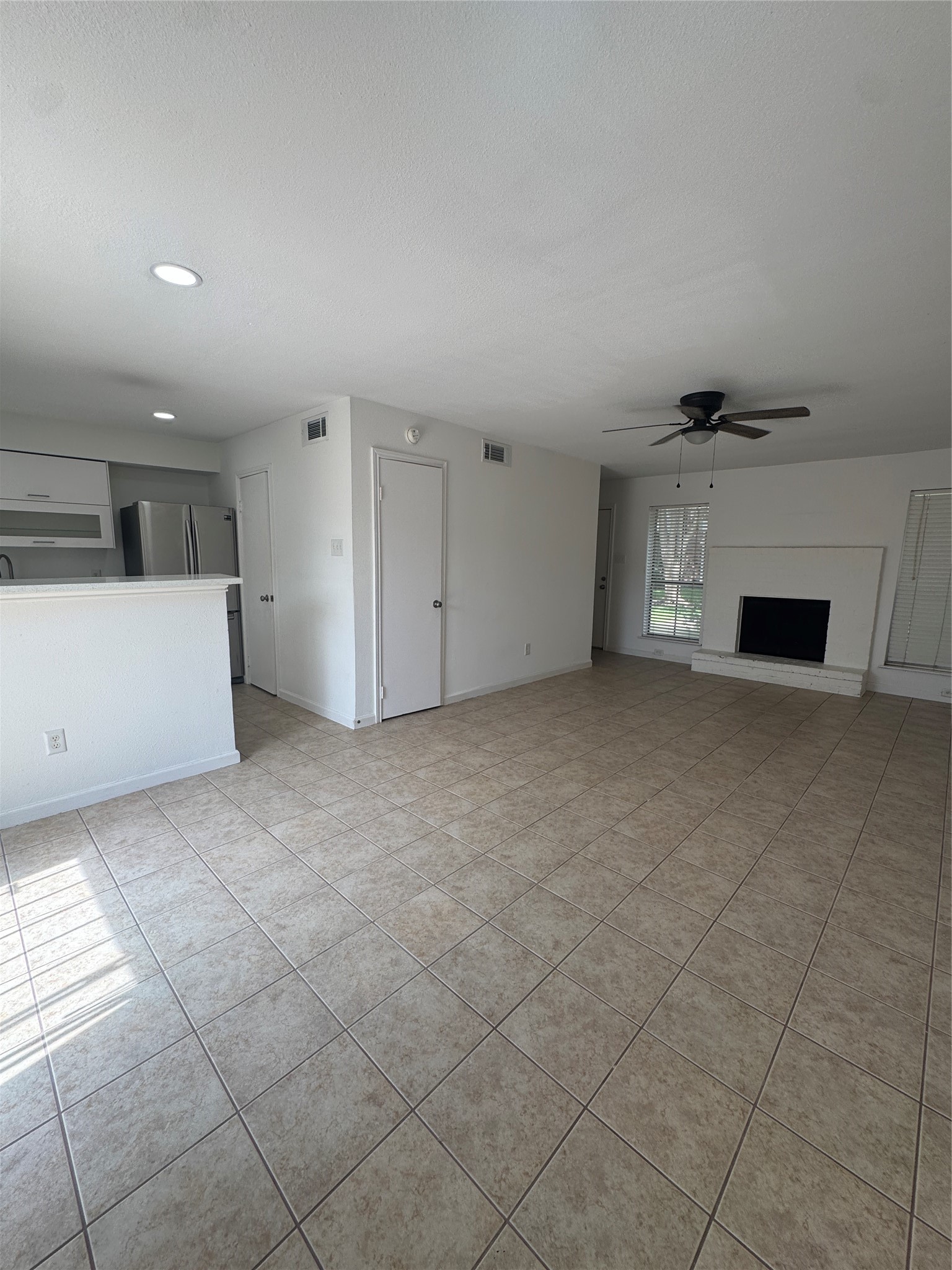 6645 Wanda Lane Houston, TX 77074 - Photo 10 of 27 The Dining area overlooks the kitchen and the living room with a fireplace