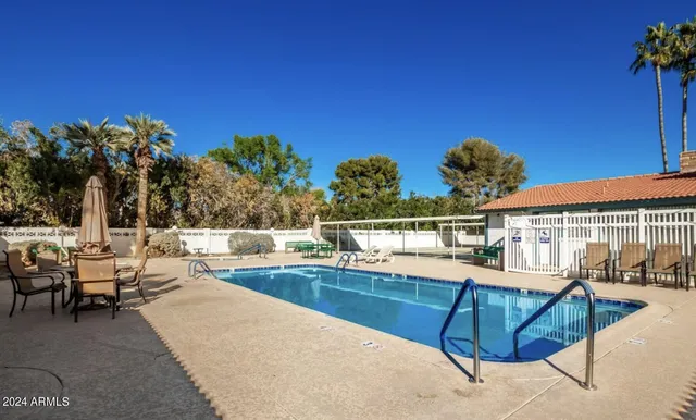 a view of a patio with swimming pool