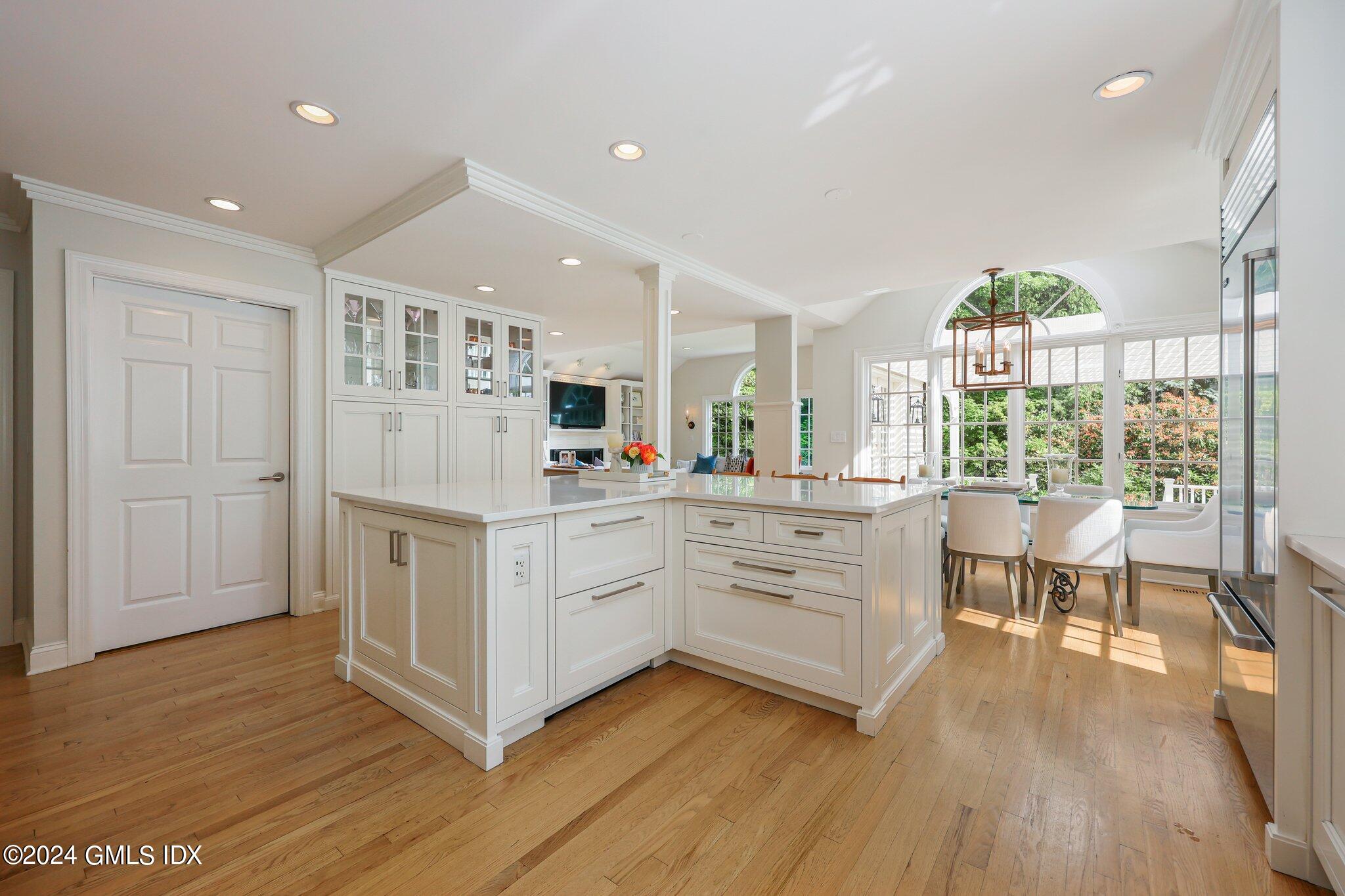 16 Wesskum Wood Road Riverside, CT 06878 - Photo 18 of 37 a kitchen with white cabinets and white appliances