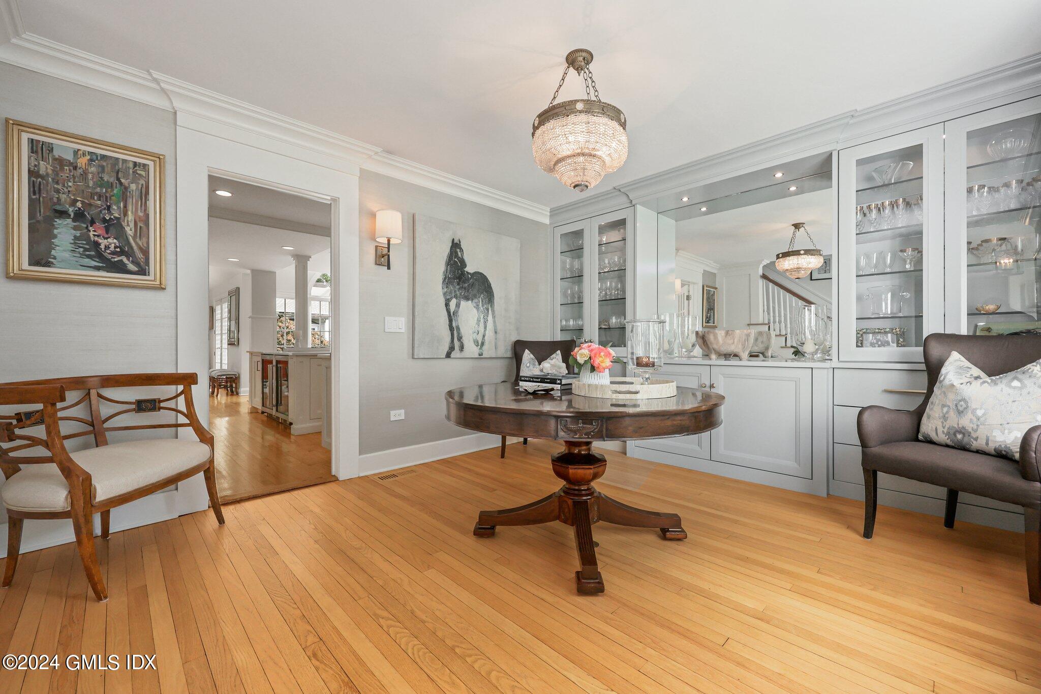 16 Wesskum Wood Road Riverside, CT 06878 - Photo 4 of 37 a living room with furniture and a chandelier