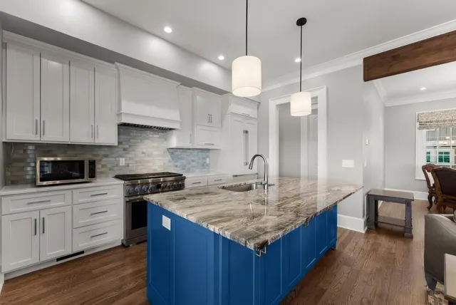 a bathroom with a granite countertop sink shower and a mirror