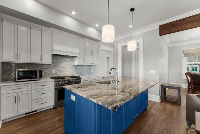 a bedroom with a bed a couch and a window