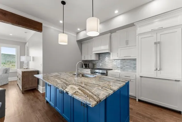 a bathroom with a granite countertop sink shower and a mirror