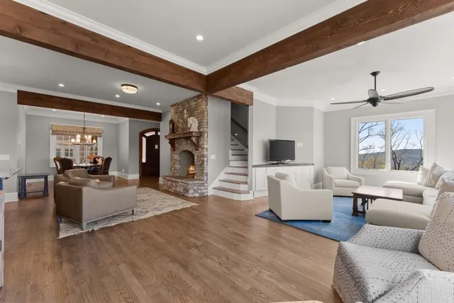 a living room with fireplace furniture and a flat screen tv