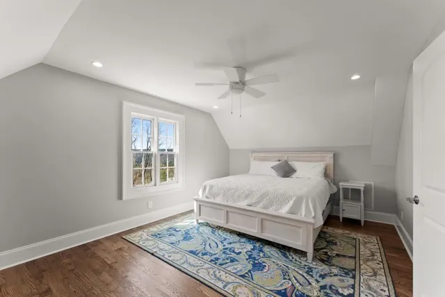 a living room with furniture flat screen tv and a fireplace