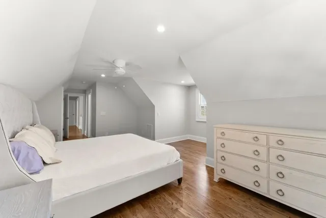 a view of an empty room with a fireplace and a window