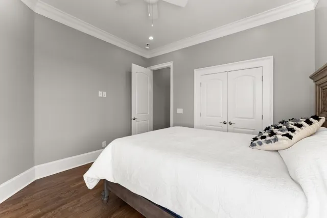 a living room with fireplace furniture and a wooden floor