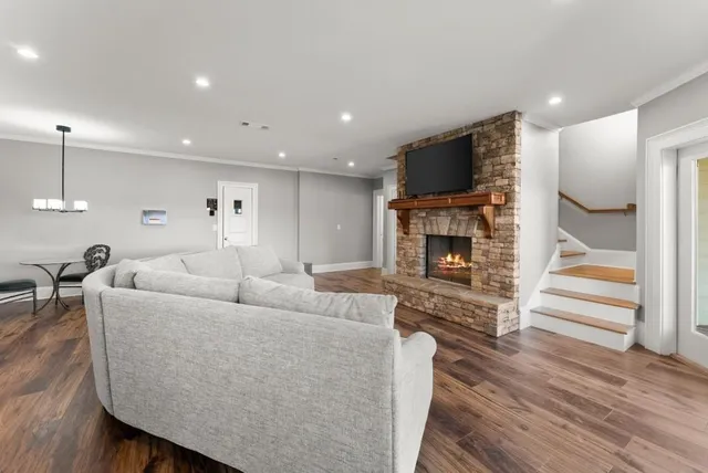 a bathroom with a granite countertop sink a toilet and shower