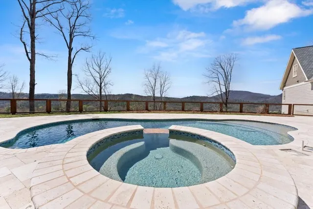 a dining room with furniture a chandelier and wooden floor