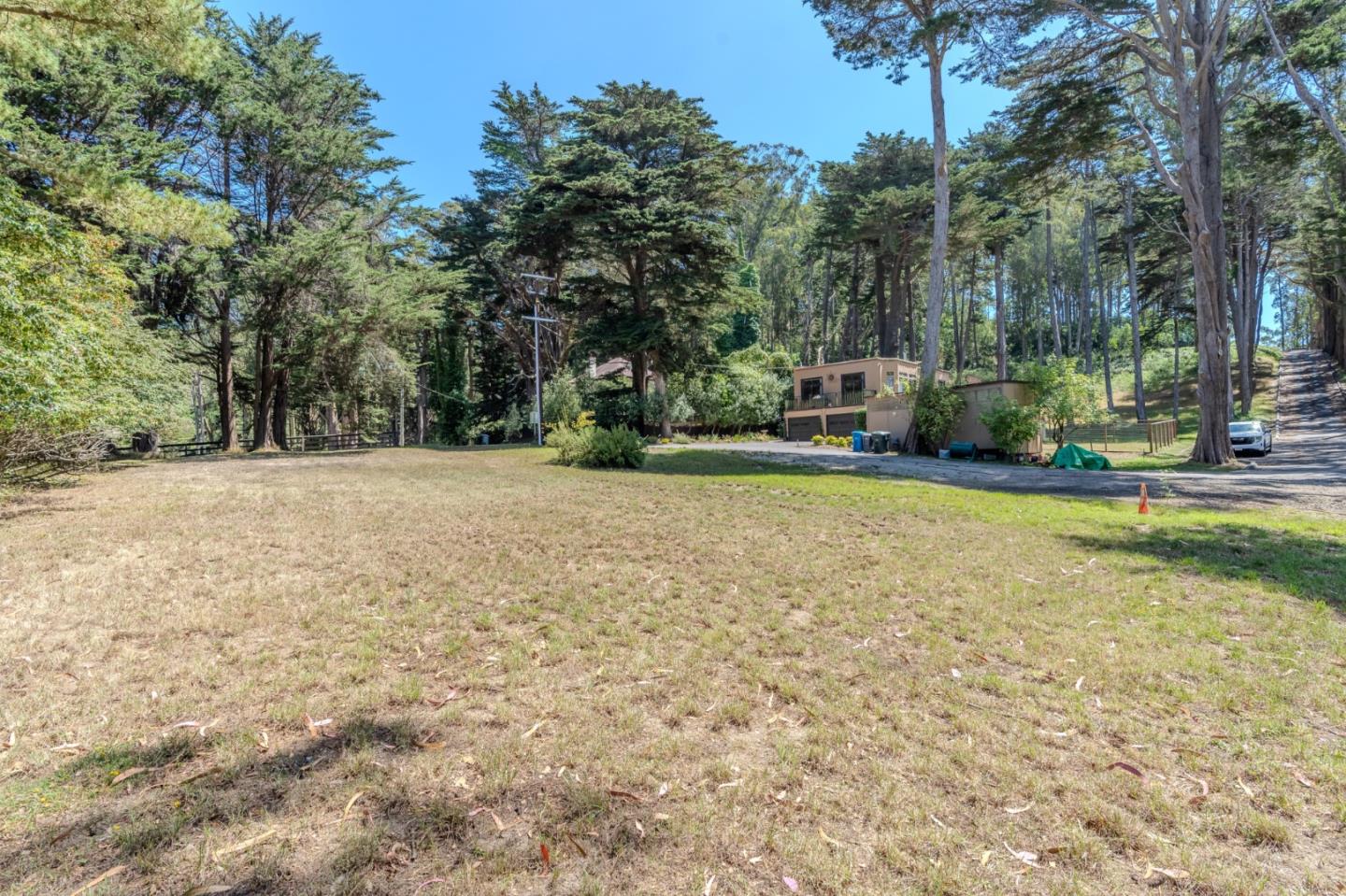 End Of End Of Hermosa Road Montara, CA 94037 - Photo 15 of 16 a view of a field with trees in front of the house