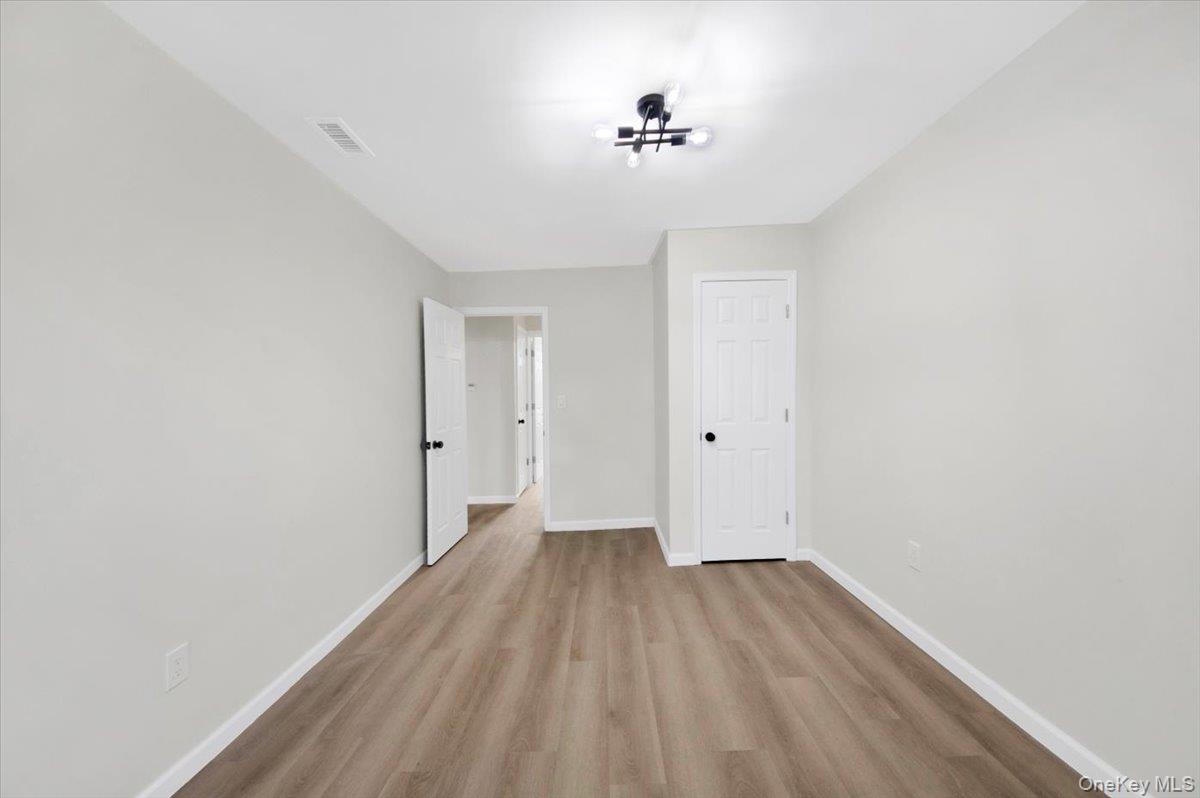 1625 Overing Street Bronx, NY 10461 - Photo 11 of 25 a view of a room with wooden floor